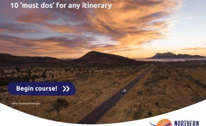 Aerial photo of a car driving in the beautiful Northern Territory outback near Alice Springs