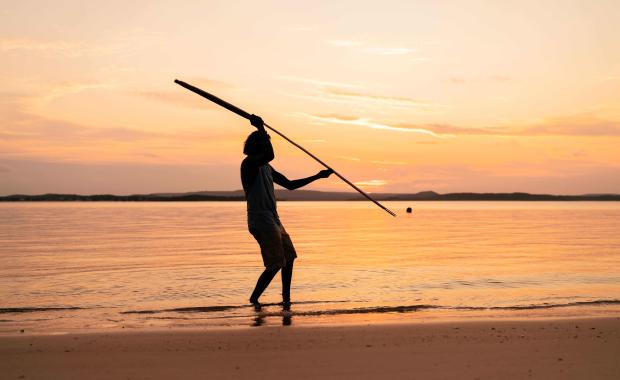 Aboriginal Tourism - Silhouette man fishing beach